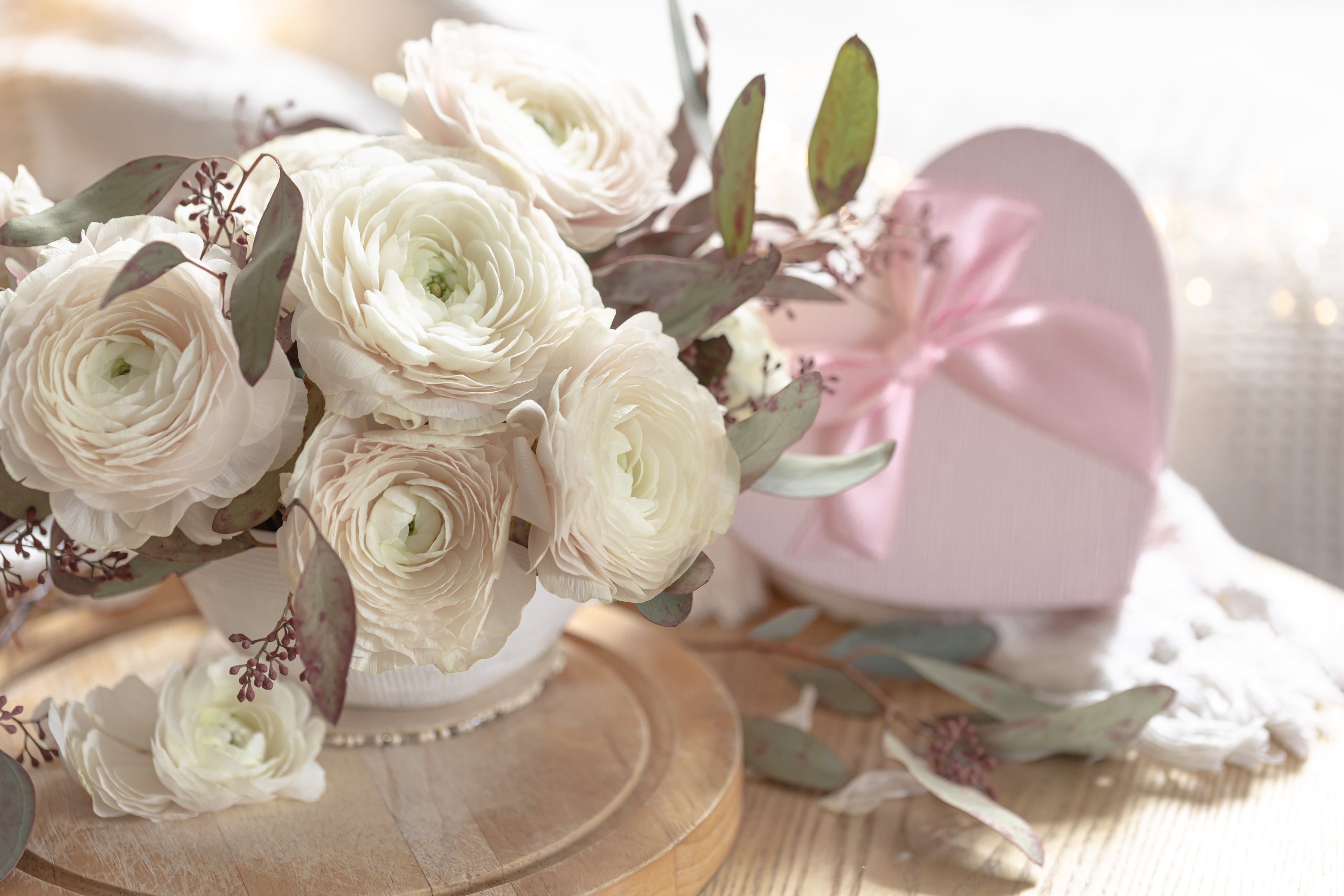 spring-composition-with-flowers-gift-box-blurred-background.jpg
